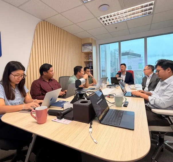 BGF team in a meeting room with the remit.go! sign