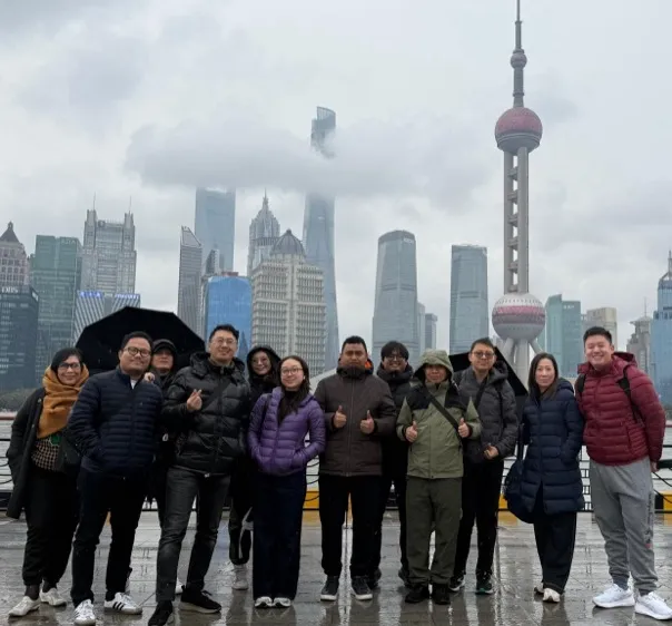 BGF team posing together on the Shanghai waterfront